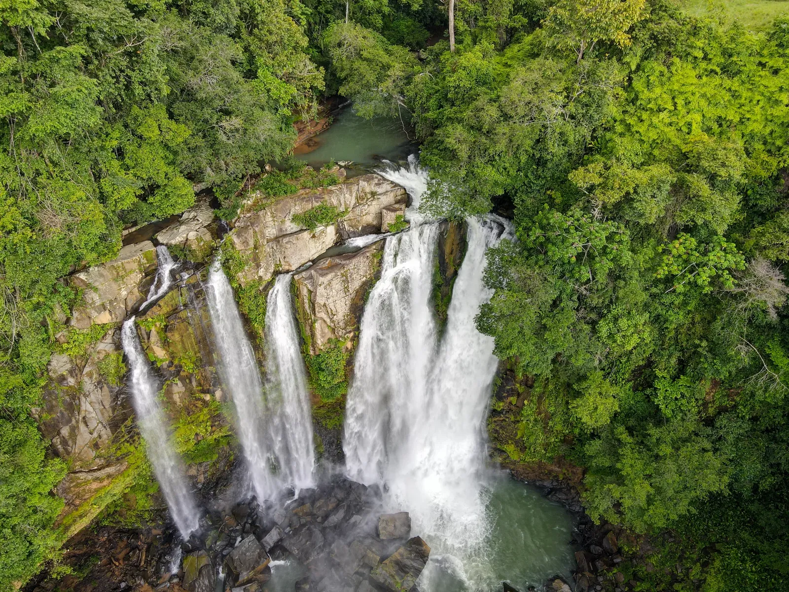 Waterfall in the forest of the Dominical–Uvita area (aerial)